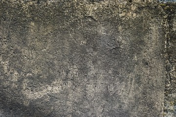 Rough concrete surface texture stained with soot and car exhaust