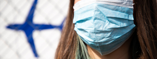 coronavirus global fight - woman wearing surgical mask and airport sign - cancelled flights -...