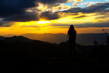 Obraz premium Sunset beautiful with silhouette of traveler