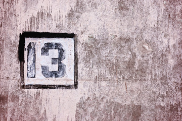 friday 13th background, number thirteen on dirty stone wall