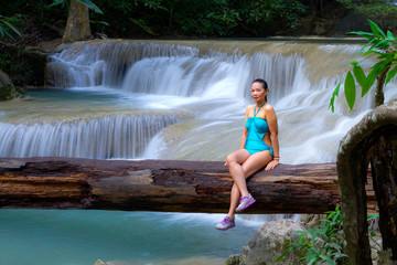 Woman with blue swimsuit at Erawan Waterfall