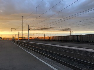 Fototapeta na wymiar railroad tracks at sunset