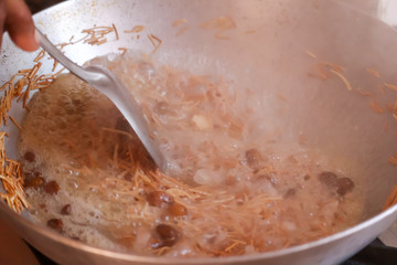 Coconut Sevai, a noodle dish from India,cocking savaiya noodle in kitchen,seva cocking at home and steam, almond and Cashew nuts sevaiya,