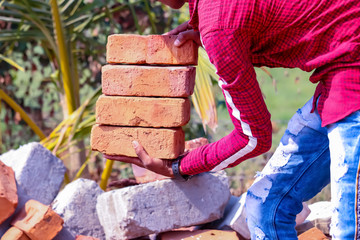 brick worker,Workers in a brick construction side,handsome hard worker people portrait at construction site,