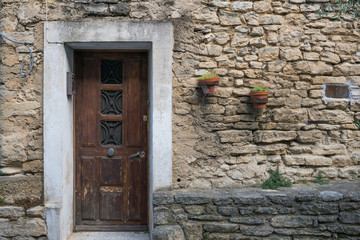 Fototapeta na wymiar Ancient brick wall and wooden door