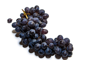 Bunches of dark grapes isolated on white background