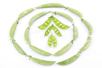 Fresh green peas isolated on white background