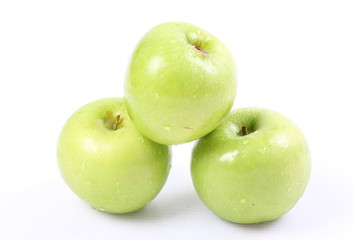 Green apples on a white background