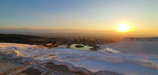 white lime cascades formed by hot mineral springs at Pamukkale, Turkey