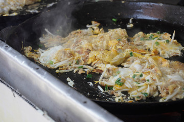 Delicious street food oh chien (Fried oyster omelette) is famous snack at Pulau Ketam restaurant.