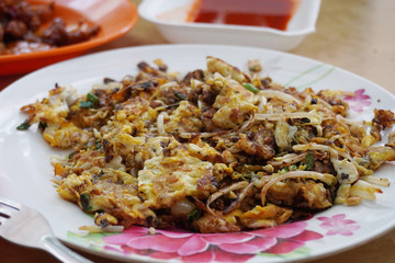 Delicious street food oh chien (Fried oyster omelette) is famous snack at Pulau Ketam restaurant.