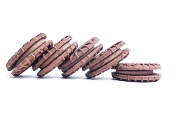 A picture of homemade chocolate cream biscuits on isolated white background.