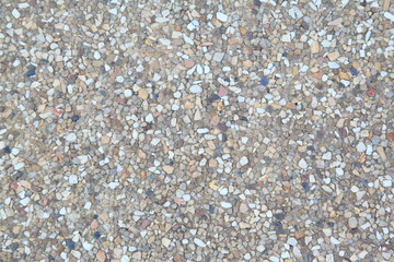 rough texture surface of exposed aggregate finish, Ground stone washed floor, made of small sand stone in light brown color