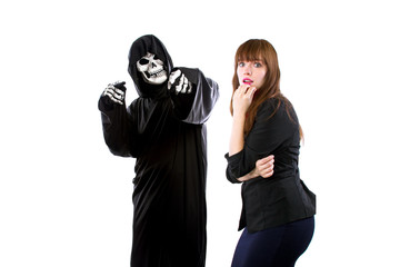 Scared businesswoman paranoid of catching a deadly disease represented by the grim reaper.  She is...