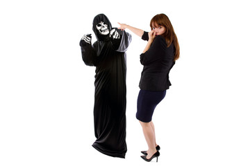 Scared businesswoman paranoid of catching a deadly disease represented by the grim reaper.  She is...