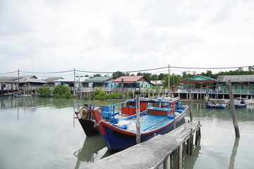 Fototapeta premium Pulau Ketam is an island at the mouth of the Klang River, near Port Klang. It host Chinese fishing villages comprising houses on stilts and the boat is the main transport here. 