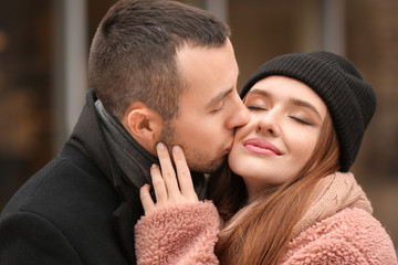 Portrait of happy young couple on romantic date outdoors