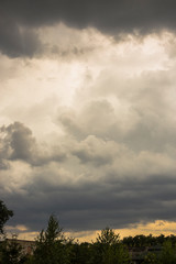  The eerie clouds had invaded the sky. Storm front over the fields. Tragic gloomy sky.