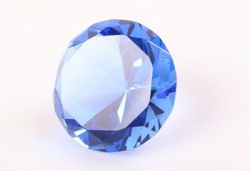 Blue diamond on white surface