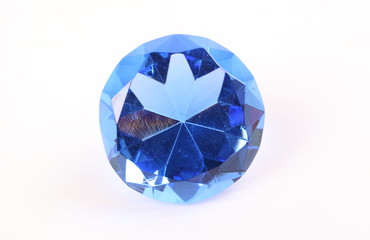 Blue diamond on white surface