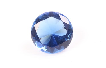 Blue diamond on white surface