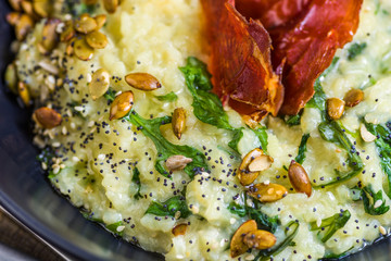 Blue Cheese Risotto with Flame Grilled Capsicum, Pumpkin Seeds and Rocket Leaves.