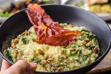 Blue Cheese Risotto with Flame Grilled Capsicum, Pumpkin Seeds and Rocket Leaves.