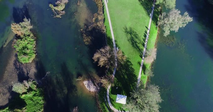 Aerial Over Krka River With Otocec Castle Below Surrounded By Lush Forest In Slovenia. Pan Up