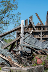 damaged barn  is a pile of wood, after strong storms