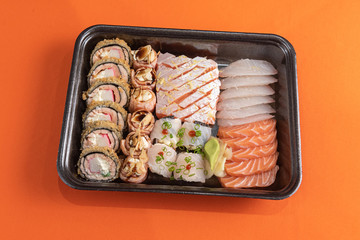 Delicious and beautiful sushi on the orange table
