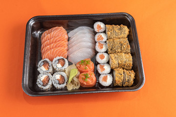 Delicious and beautiful sushi on the orange table