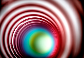 Looking inside colorful flexible bouncy plastic spring