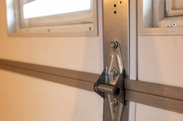 Garage door metal panel hinge 