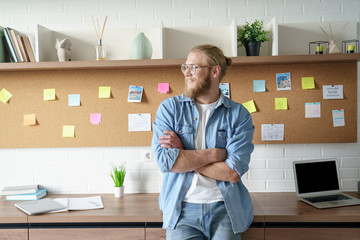 Young happy man student guy geek hipster freelancer wear glasses work from home office study online...