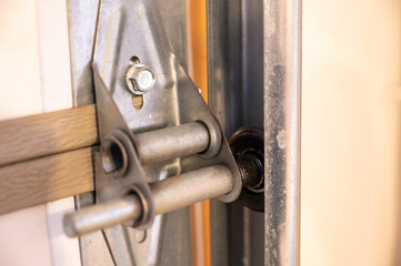 Garage door metal panel hinge 