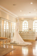 Wedding dress on mannequin in fashion designer store
