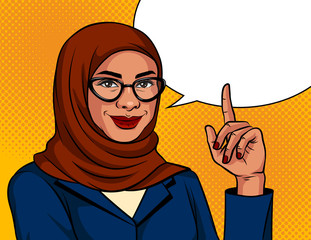Vector color illustration in pop art style. Muslim woman in a traditional scarf and glasses is pointing finger up. Advertising banner with Arabic successful business woman over dot background