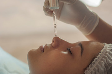Placement of hydration product on woman's face