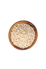Raw oat-flakes in wooden bowl. Isolated on white background. Top view on uncooked dry rolled oatmeal.