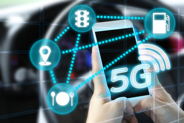5G network wireless systems and internet of things.Mobile technology concept.A woman using smartphone in the car for communication.