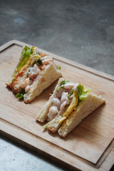 Delicious crayfish/king prawn with cheese and omelette sandwich on malted bread and mayonnaise on fresh lettuce.