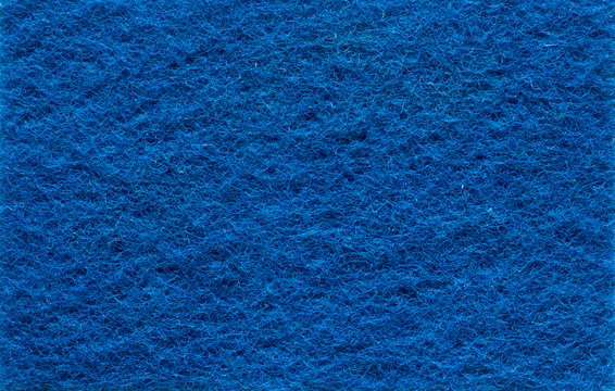 Blue background with texture Scotch Brite .Close-up