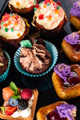 set of pastries on the black background