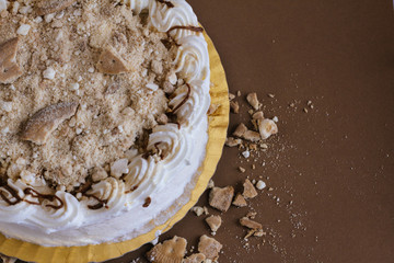 White cream cake with cookies pieces