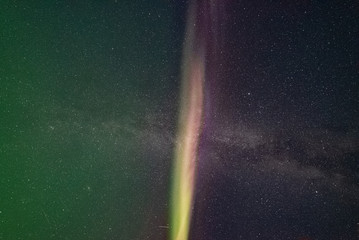 Aurora Borealis Northern Lights Yukon Territory Canada looking directly up with purple, green &...