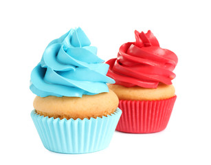 Delicious birthday cupcakes with buttercream on white background
