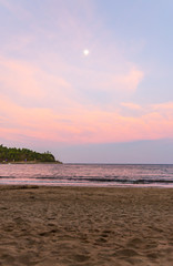Sunset over the water at Corbyns Cove Beach in Port Blair, Andaman and Nicobar Islands, India a late evening during the festival. 
