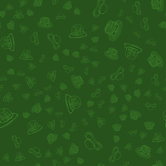 Seamless pattern with women hats on a green background.