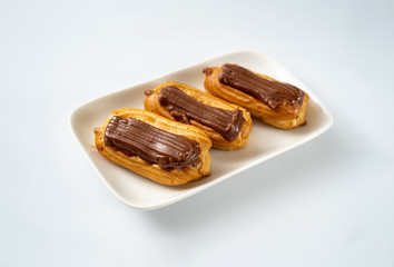 cakes chocolate icing and coffee white background
