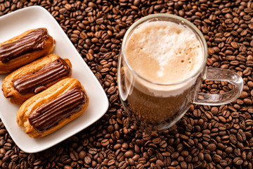 top view. coffee, custard cake, background coffee.
